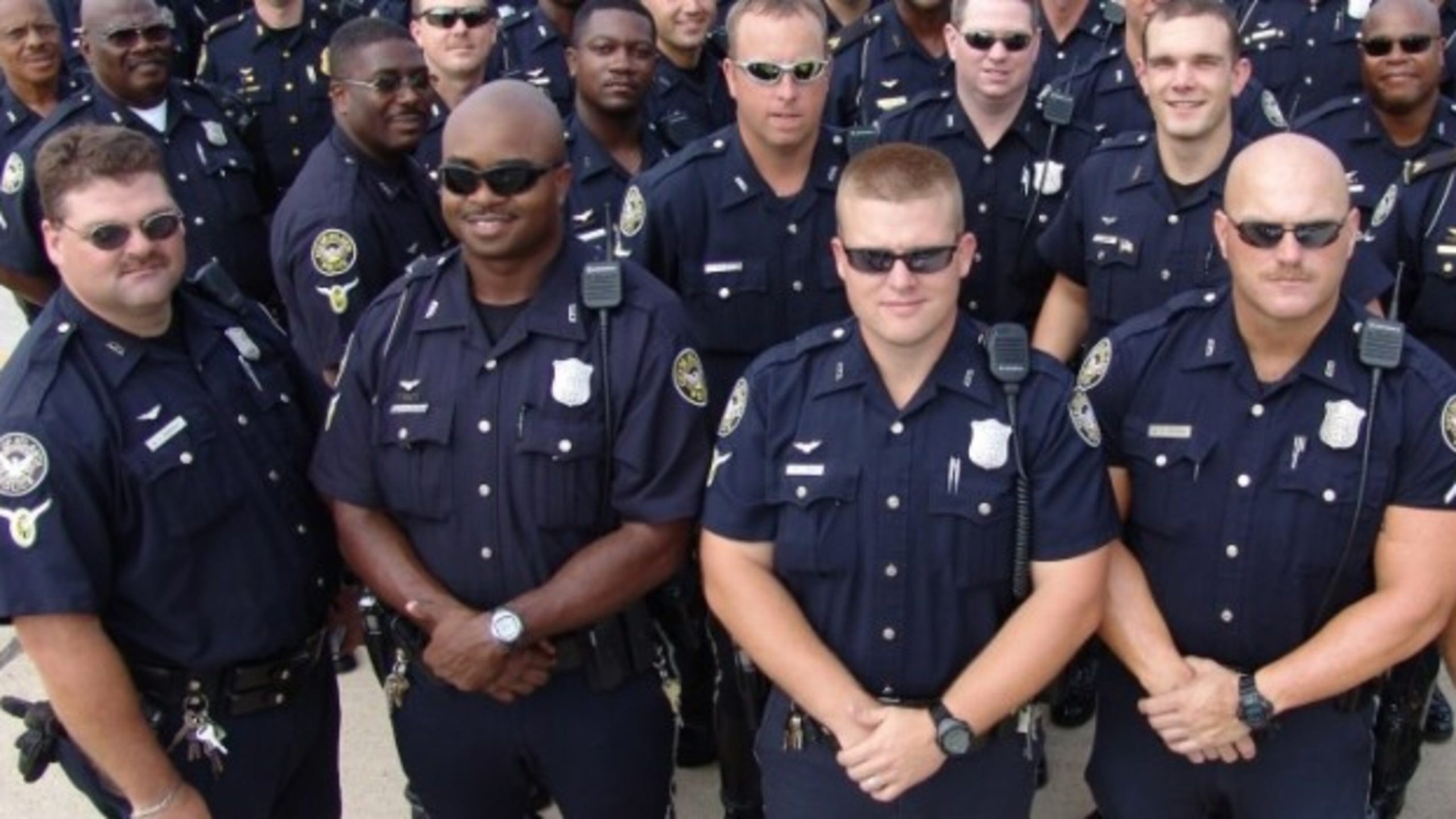 A diverse group of modern law enforcement recruits ready for the academy